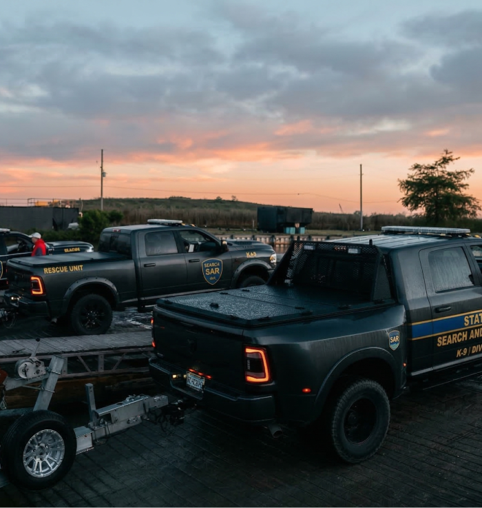 Fast-access DiamondBack 180 truck cover used by first responder fleet vehicles.